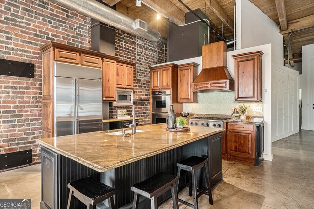 204 Walker St SW Unit 319, Atlanta, GA 30313 - kitchen with a high ceiling, built in appliances, a sink, finished concrete flooring, and tasteful backsplash