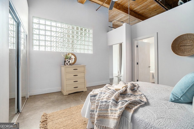 204 Walker St SW Unit 319, Atlanta, GA 30313 - bedroom featuring wood ceiling, concrete floors, ensuite bath, and baseboards