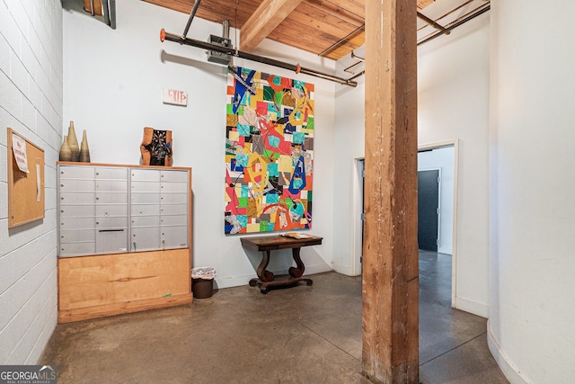 204 Walker St SW Unit 319, Atlanta, GA 30313 - miscellaneous room featuring concrete flooring, wood ceiling, and baseboards