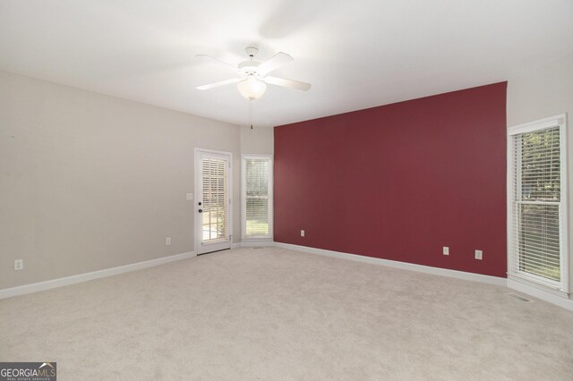 3780 Lovers Ln, Monroe, GA 30656 - spare room with a ceiling fan, light colored carpet, and baseboards