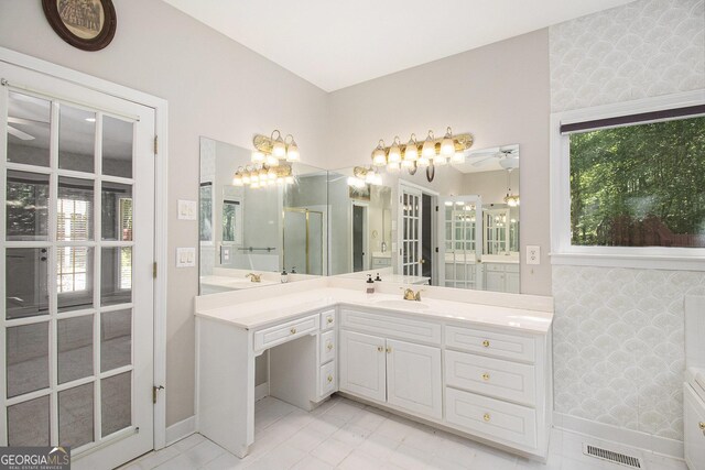3780 Lovers Ln, Monroe, GA 30656 - full bath featuring vanity, tile patterned flooring, baseboards, ceiling fan, and an enclosed shower
