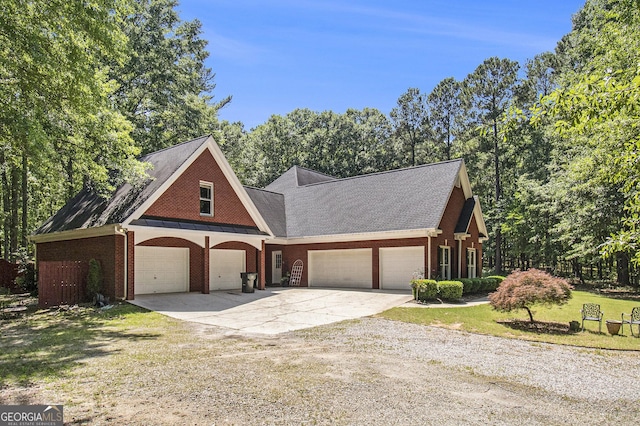 3780 Lovers Ln, Monroe, GA 30656 - view of front of property featuring driveway, brick siding, a garage, a front lawn, and a shingled roof