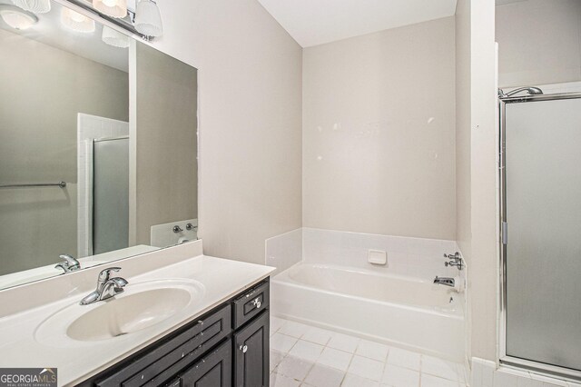 3780 Lovers Ln, Monroe, GA 30656 - full bath with vanity, a bath, a stall shower, and tile patterned floors