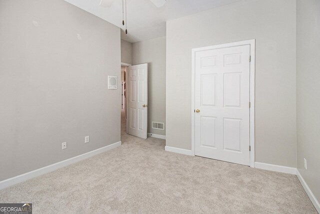 3780 Lovers Ln, Monroe, GA 30656 - unfurnished bedroom with light colored carpet, baseboards, and a ceiling fan