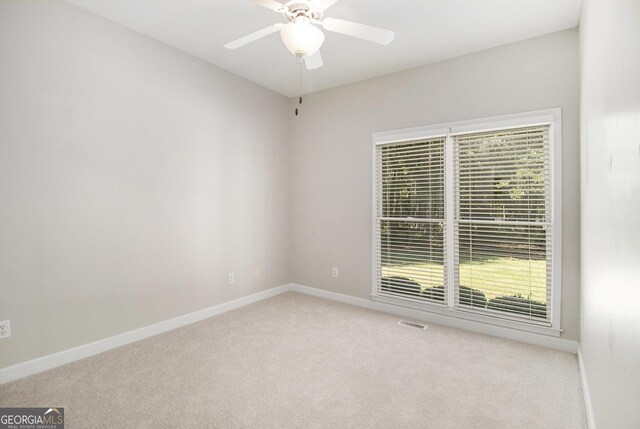 3780 Lovers Ln, Monroe, GA 30656 - empty room featuring light carpet, a ceiling fan, and baseboards