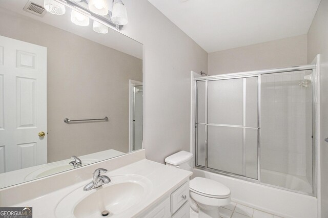 3780 Lovers Ln, Monroe, GA 30656 - bathroom featuring vanity, combined bath / shower with glass door, toilet, and tile patterned flooring