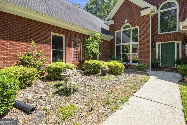 3780 Lovers Ln, Monroe, GA 30656 - property entrance featuring brick siding and a shingled roof