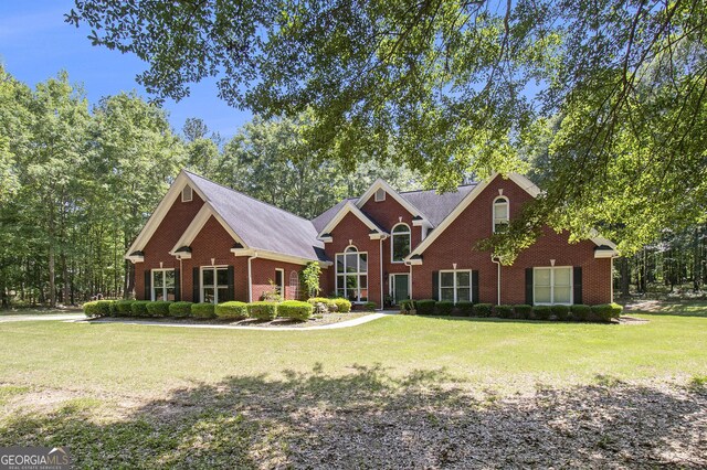3780 Lovers Ln, Monroe, GA 30656 - traditional home featuring brick siding and a front yard