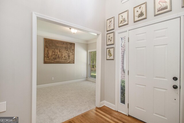 3780 Lovers Ln, Monroe, GA 30656 - foyer featuring crown molding, baseboards, and wood finished floors