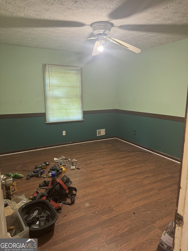 411 Willow Ct SE, Conyers, GA 30094 - unfurnished room with wood finished floors, a ceiling fan, and a textured ceiling