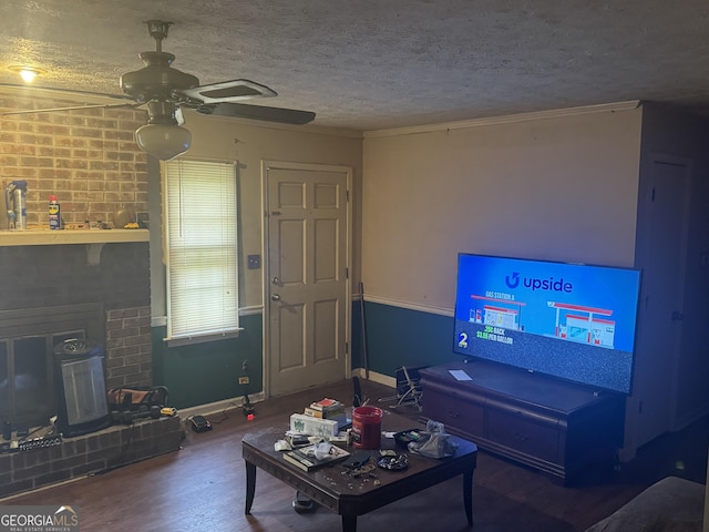 411 Willow Ct SE, Conyers, GA 30094 - living area with wood finished floors, a ceiling fan, a textured ceiling, baseboards, and ornamental molding