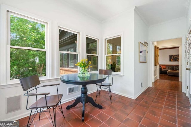 4411 Paces Battle NW, Atlanta, GA 30327 - dining room featuring healthy amount of natural light, crown molding, and dark tile patterned floors