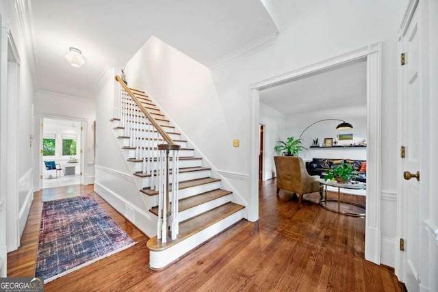 4411 Paces Battle NW, Atlanta, GA 30327 - stairs with crown molding and wood finished floors