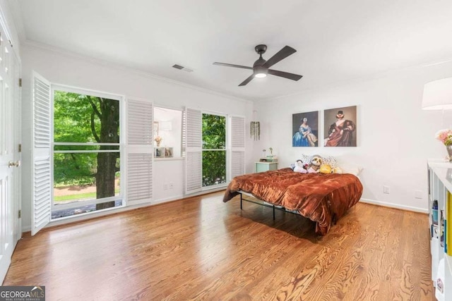 4411 Paces Battle NW, Atlanta, GA 30327 - bedroom featuring multiple windows, wood finished floors, crown molding, ceiling fan, and access to outside