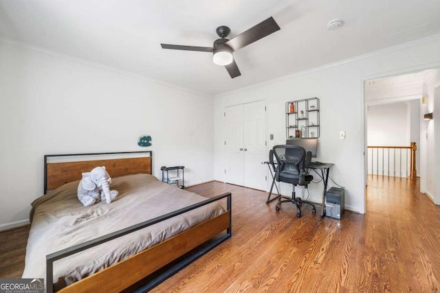 4411 Paces Battle NW, Atlanta, GA 30327 - bedroom featuring ornamental molding, wood finished floors, a closet, and ceiling fan