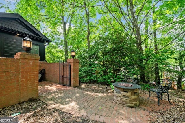 4411 Paces Battle NW, Atlanta, GA 30327 - view of patio / terrace with a fire pit and a gate