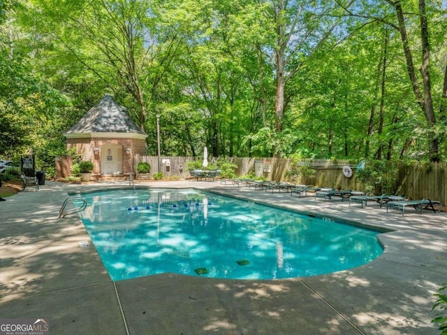 4411 Paces Battle NW, Atlanta, GA 30327 - community pool featuring a patio area and a fenced backyard