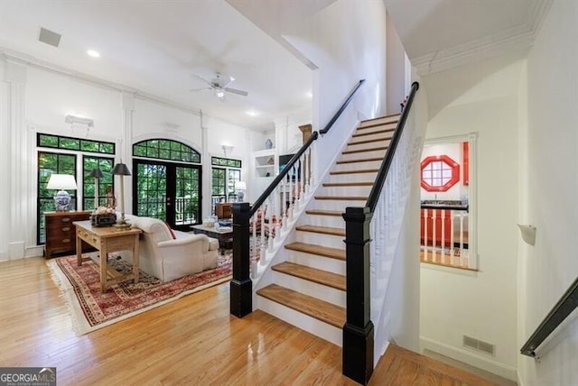 4470 Crestwicke Pointe, Atlanta, GA 30319 - stairway featuring ceiling fan, healthy amount of natural light, wood finished floors, recessed lighting, and ornamental molding