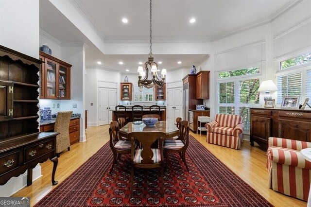 4470 Crestwicke Pointe, Atlanta, GA 30319 - dining room featuring a chandelier, light wood-style floors, ornamental molding, and recessed lighting