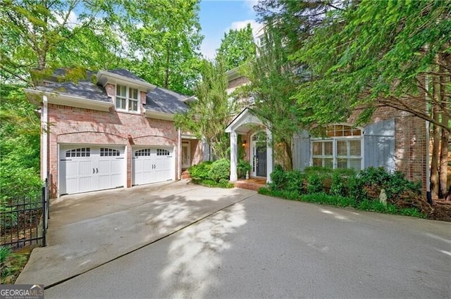 4470 Crestwicke Pointe, Atlanta, GA 30319 - view of front facade with brick siding, a garage, and concrete driveway