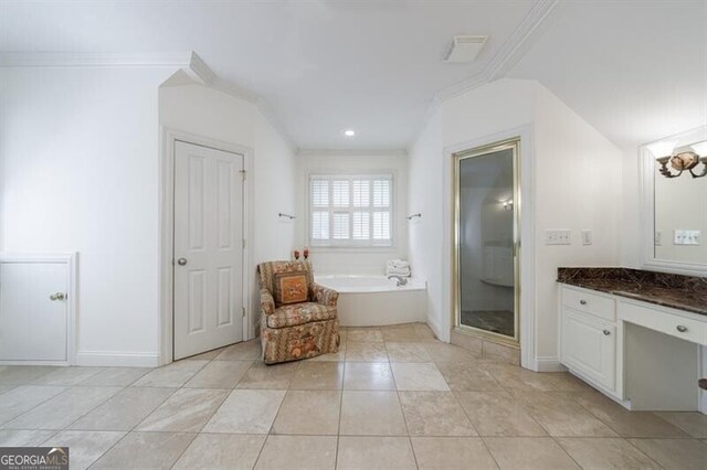 4470 Crestwicke Pointe, Atlanta, GA 30319 - full bath featuring crown molding, a garden tub, vanity, a shower stall, and tile patterned flooring