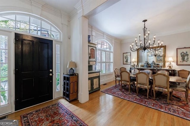 4470 Crestwicke Pointe, Atlanta, GA 30319 - entryway featuring a chandelier, wood finished floors, and crown molding