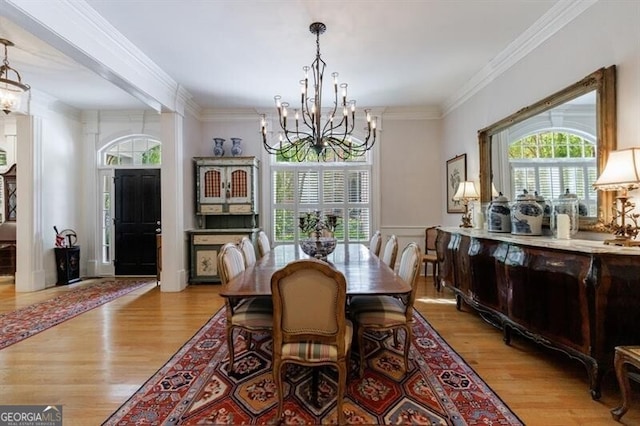 4470 Crestwicke Pointe, Atlanta, GA 30319 - dining area featuring a chandelier, wood finished floors, and crown molding