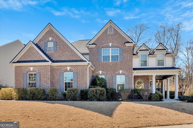 138 Lakestone Pkwy, Woodstock, GA 30188 - view of front of house with brick siding and a front lawn