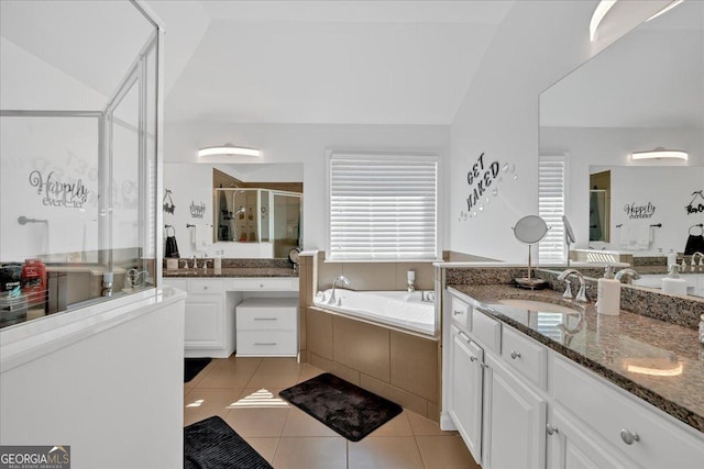 138 Lakestone Pkwy, Woodstock, GA 30188 - bathroom with tile patterned flooring, a shower stall, two vanities, and a garden tub