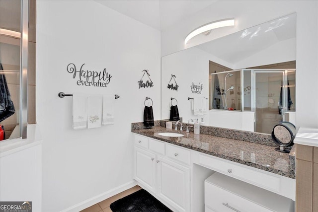 138 Lakestone Pkwy, Woodstock, GA 30188 - full bath with a shower stall, vanity, lofted ceiling, and tile patterned flooring