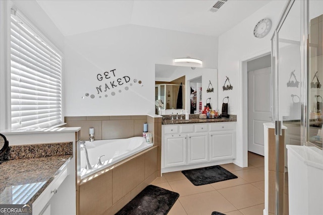 138 Lakestone Pkwy, Woodstock, GA 30188 - bathroom featuring a shower stall, tile patterned floors, vanity, a garden tub, and plenty of natural light