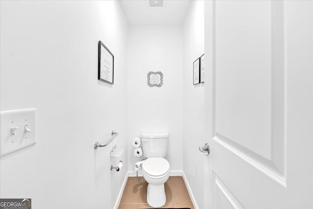 138 Lakestone Pkwy, Woodstock, GA 30188 - bathroom with baseboards, tile patterned flooring, and toilet