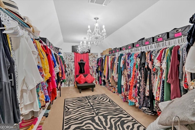 138 Lakestone Pkwy, Woodstock, GA 30188 - spacious closet with a chandelier, carpet, and vaulted ceiling
