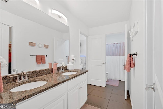 138 Lakestone Pkwy, Woodstock, GA 30188 - full bathroom with tile patterned flooring, double vanity, and toilet