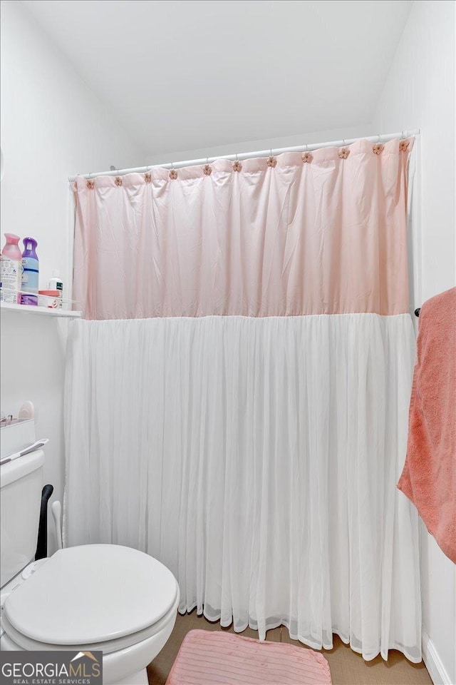 138 Lakestone Pkwy, Woodstock, GA 30188 - bathroom featuring toilet and curtained shower
