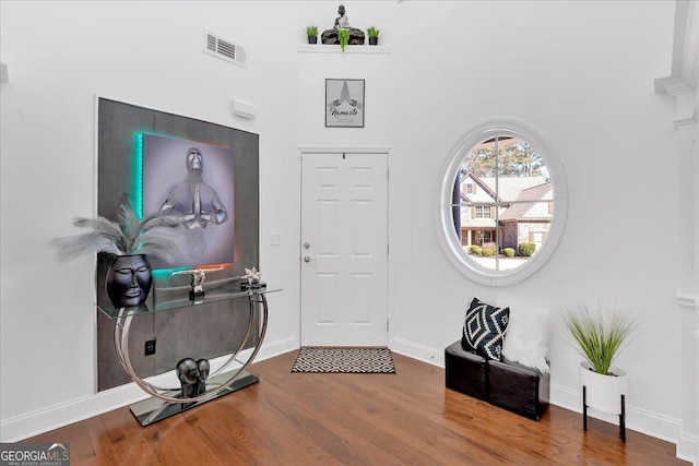 138 Lakestone Pkwy, Woodstock, GA 30188 - entryway with wood finished floors, baseboards, and a towering ceiling