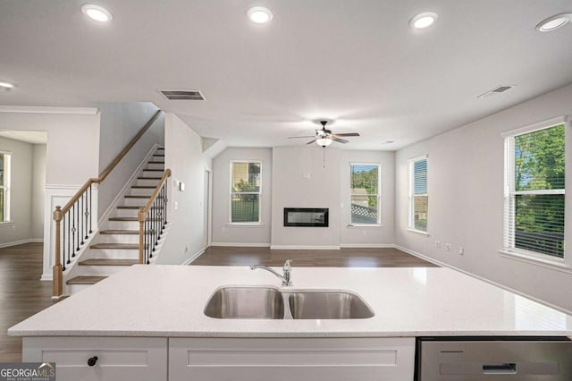 953 Mystic Way, Hampton, GA 30228 - kitchen featuring dishwasher, open floor plan, white cabinetry, a ceiling fan, and light stone countertops