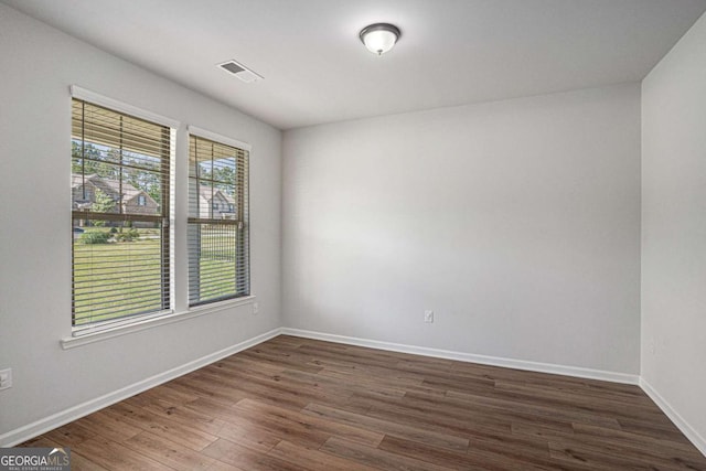 953 Mystic Way, Hampton, GA 30228 - spare room with dark wood-style flooring and baseboards