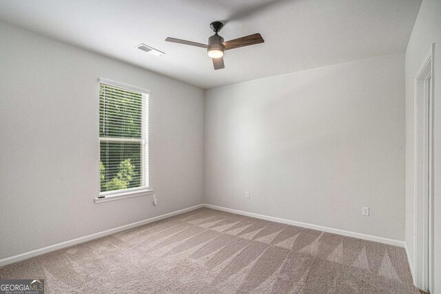 953 Mystic Way, Hampton, GA 30228 - unfurnished room with healthy amount of natural light, ceiling fan, and carpet