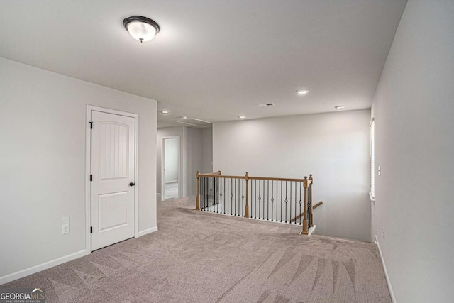 953 Mystic Way, Hampton, GA 30228 - spare room featuring carpet flooring, recessed lighting, and attic access