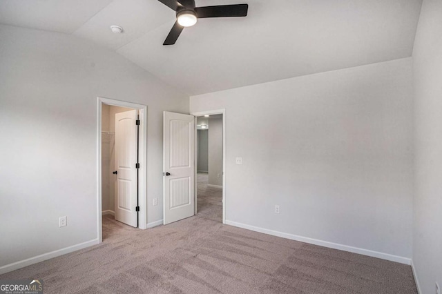 953 Mystic Way, Hampton, GA 30228 - unfurnished bedroom with a spacious closet, lofted ceiling, carpet, ceiling fan, and a closet
