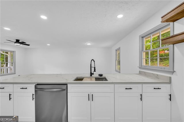 5200 Beechwood Forest Ct, Lithonia, GA 30038 - kitchen with stainless steel dishwasher, white cabinets, recessed lighting, light stone countertops, and a textured ceiling