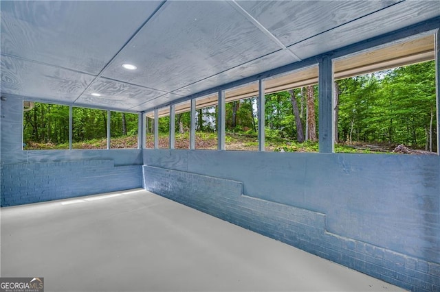unfurnished sunroom featuring plenty of natural light