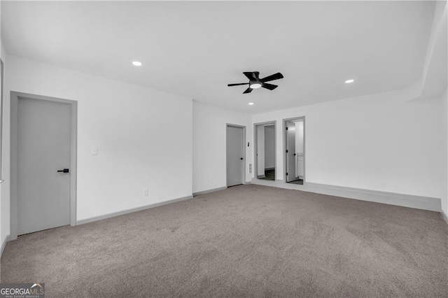 carpeted empty room featuring recessed lighting, a ceiling fan, and baseboards