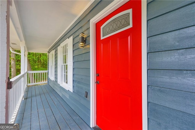 doorway to property featuring covered porch