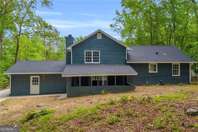 5200 Beechwood Forest Ct, Lithonia, GA 30038 - back of house featuring a chimney, a sunroom, and roof with shingles