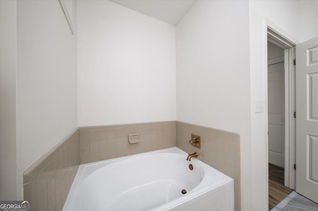 full bathroom with a bath