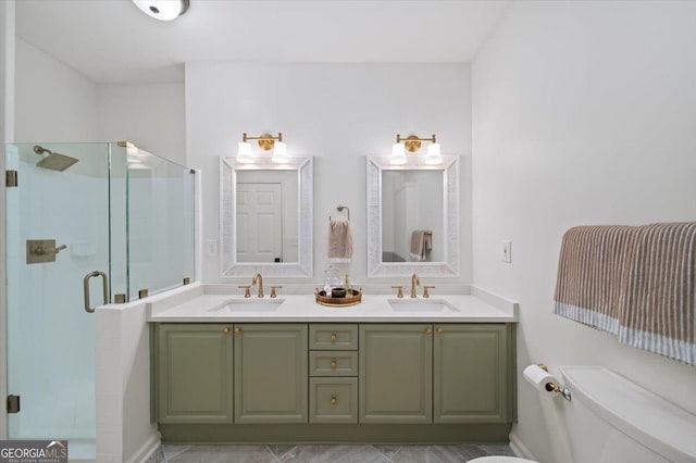 bathroom featuring a stall shower, toilet, and double vanity