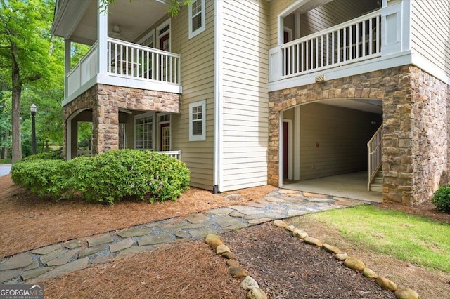 311 Pembrooke Cir, Alpharetta, GA 30004 - view of side of property featuring a balcony and stone siding