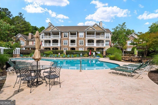 community pool featuring a patio
